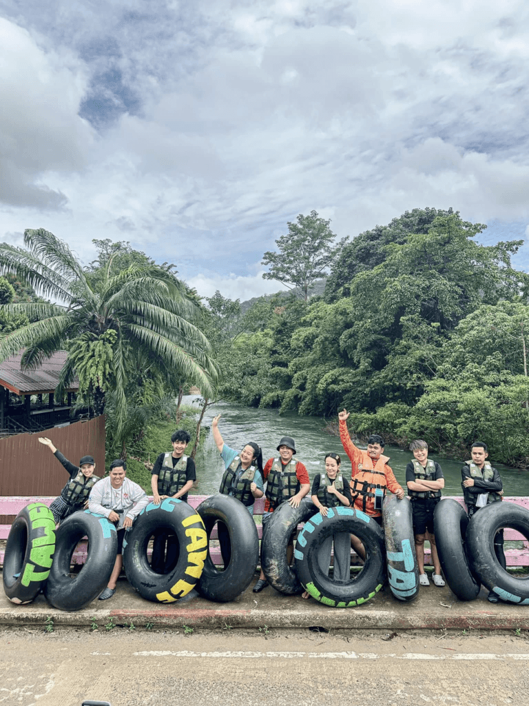 Khao Sok tubing adventure on Sok River with guests floating on swim tubes through jungle scenery and wildlife in Khao Sok National Park